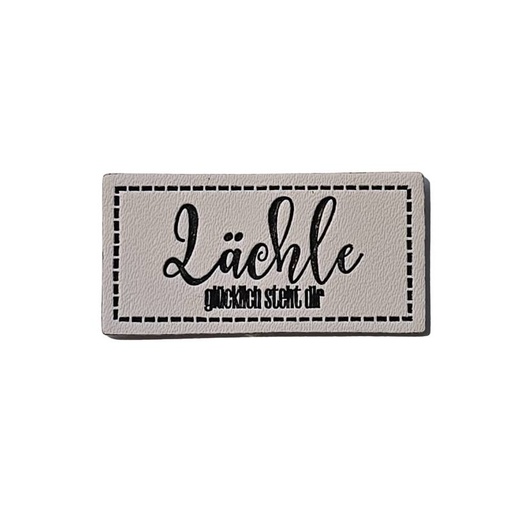 [629 3447 000] "Lächle - glücklich steht dir" Kunstleder Label 4 x 2 cm